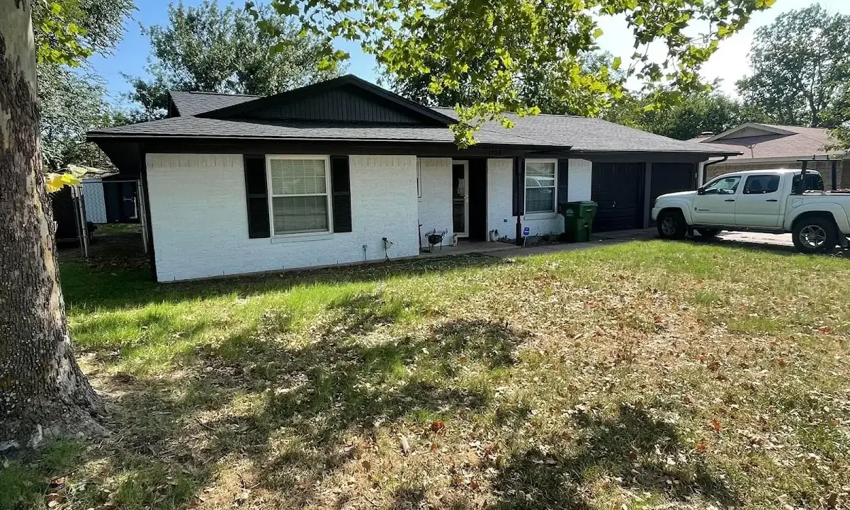 Professional roofing crew working on a residential roof in Huntingdon